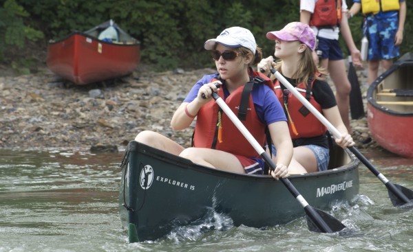 Aquatic Adventures Canoe Two girls paddling a canoe