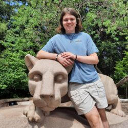 Christopher Cole poses with the Penn State Lion Shrine