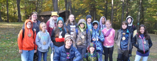 A group of Outdoor School students and their leader.