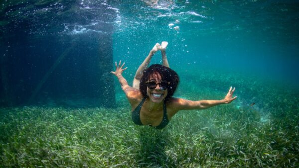 Ayana Elizabeth Johnson swimming in the ocean